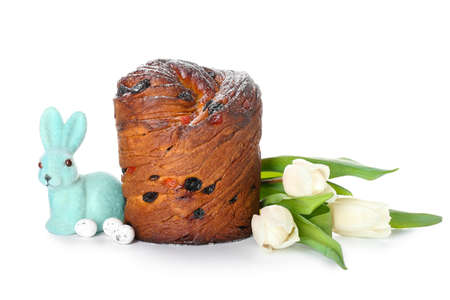 Delicious Easter cake, rabbit and tulip flowers on white background