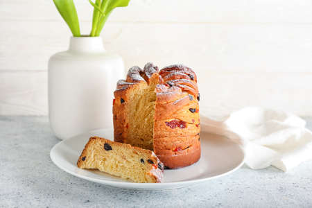 Plate with delicious Easter cake on table