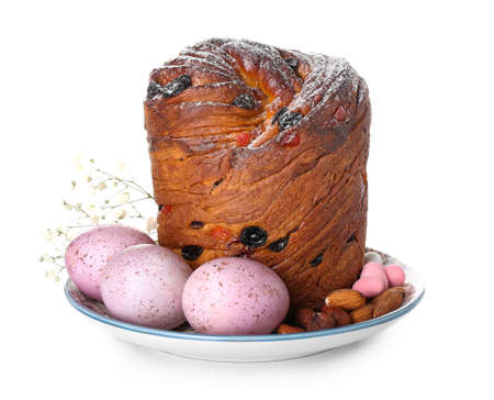 Plate with delicious Easter cake and eggs on white background