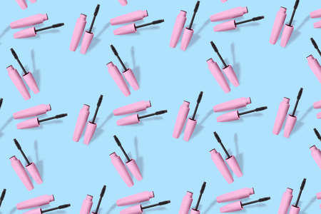 Black mascara on blue background. pattern for designの写真素材