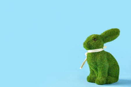 Cute Easter bunny on blue backgroundの写真素材