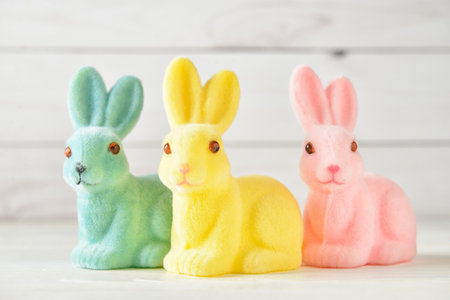 Cute Easter bunnies on light backgroundの写真素材