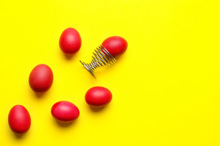 Composition with beautiful Easter eggs on yellow backgroundの写真素材