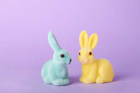 Beautiful Easter bunnies on purple background