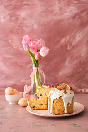 Plate with delicious Easter cakes and eggs on tableの写真素材