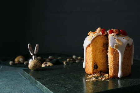 Board with delicious Easter cake on tableの写真素材