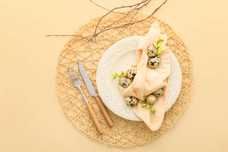 Beautiful table setting for Easter celebration on beige background