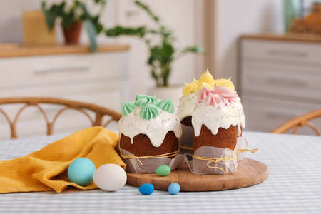 Tasty Easter cakes and eggs on the table in the kitchen