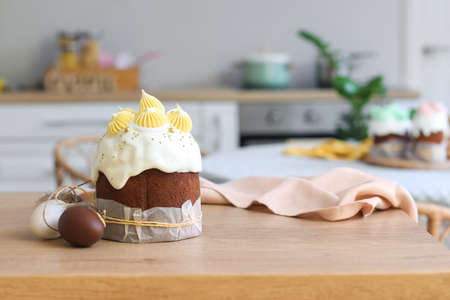 Tasty Easter cake and eggs on the table in the kitchen
