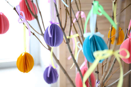 Tree branches with Easter decor in room, closeup