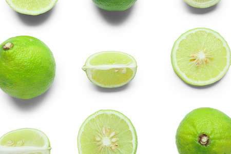 Composition with whole and cut bergamot fruits on white background