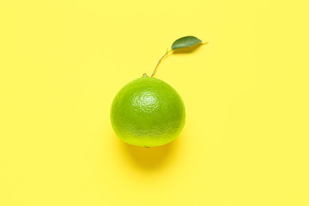 Ripe bergamot fruit on yellow backgroundの写真素材