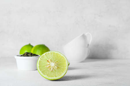 Slice of juicy bergamot fruit on light backgroundの写真素材