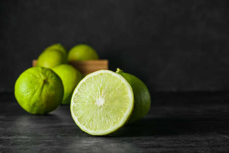 Slice of ripe bergamot fruit on dark background