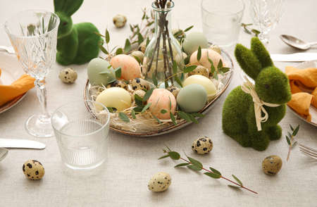 Glasses and Easter decor on light background