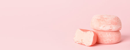 Tasty Japanese mochi on pink background with space for textの写真素材