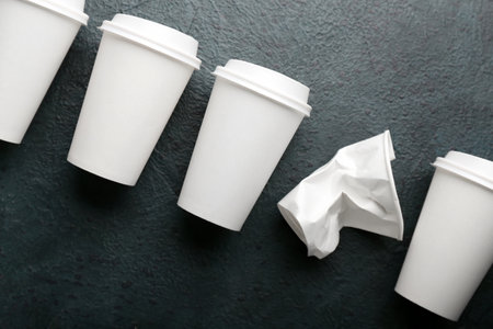 Takeaway paper cups on black backgroundの写真素材