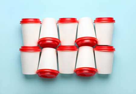 Takeaway paper cups on blue backgroundの写真素材