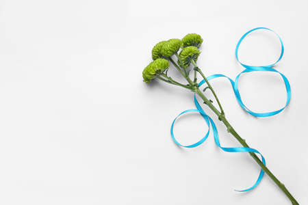 Figure 8 made of ribbon and flowers for International Women's Day celebration on light backgroundの写真素材