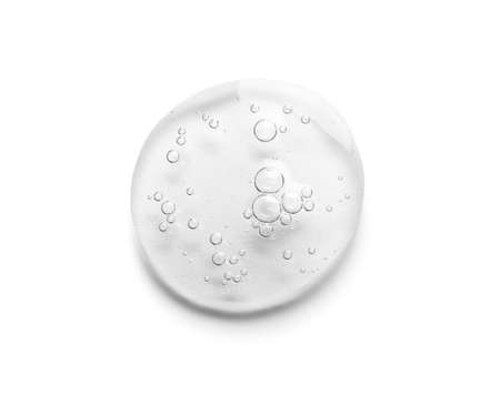 Drop of cosmetic serum on white backgroundの写真素材