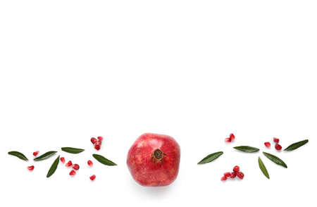 Tasty ripe pomegranate with seeds on white backgroundの写真素材