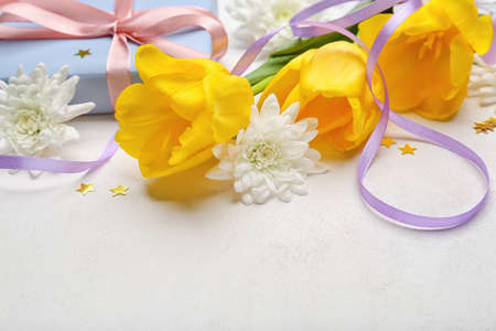 Composition with beautiful flowers for International Women's Day celebration on light background, closeupの写真素材