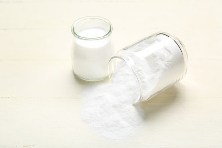 Jars with baking soda on white wooden backgroundの写真素材