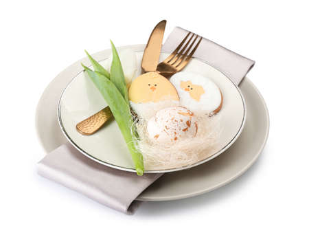 Stylish table setting with Easter cookies on white background