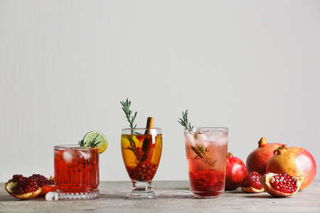 Glasses of tasty pomegranate cocktail on tableの写真素材