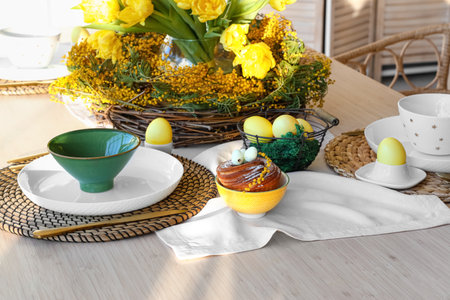 Delicious bun and Easter decor on served dining table