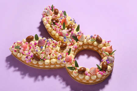 Beautiful cake for Easter celebration on purple background