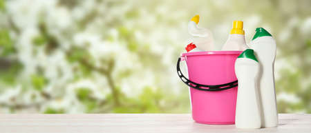 Different cleaning supplies on table outdoorsの写真素材