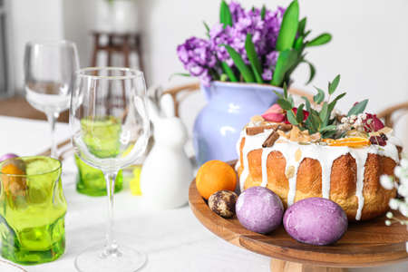 Stand with Easter cake and eggs on served table, closeupの写真素材