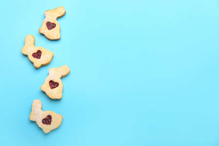 Delicious Easter cookies on blue background