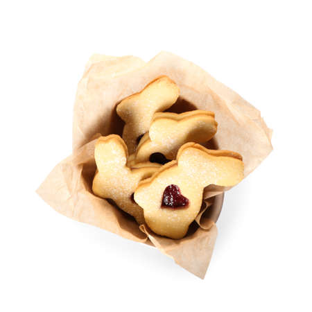 Bowl with delicious Easter cookies on white background