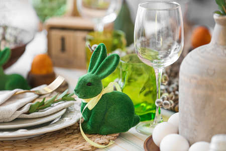 Cute rabbit on dining table served for Easter celebration, closeupの写真素材