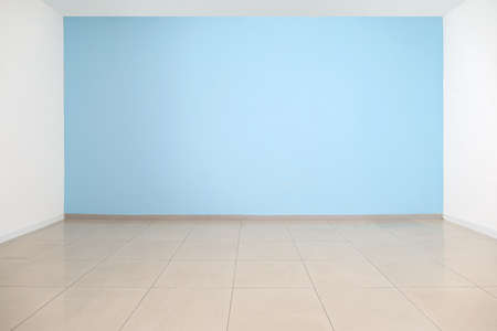 View of blue wall in big empty room