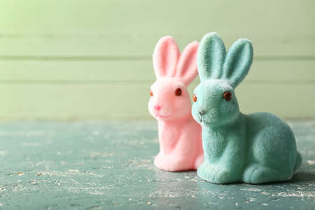 Different cute Easter bunnies on color backgroundの写真素材