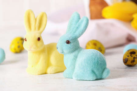 Cute Easter bunnies on table, closeupの写真素材