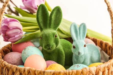 Basket with Easter eggs and bunnies, closeupの写真素材
