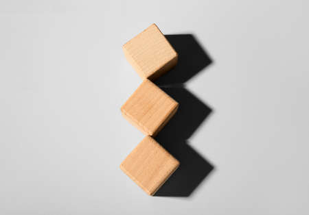 wooden cubes on light backgroundの写真素材