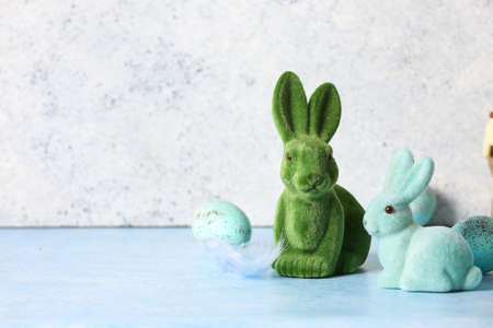 Cute Easter bunnies on color tableの写真素材