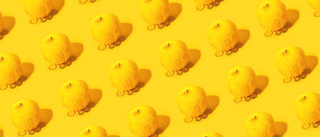 Fresh apples with honey on yellow background. pattern for designの写真素材