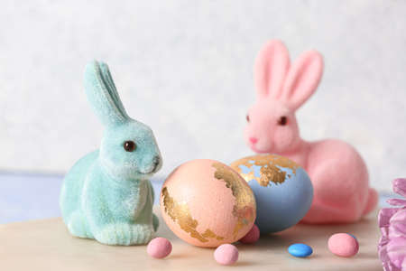 Easter eggs and bunnies on table