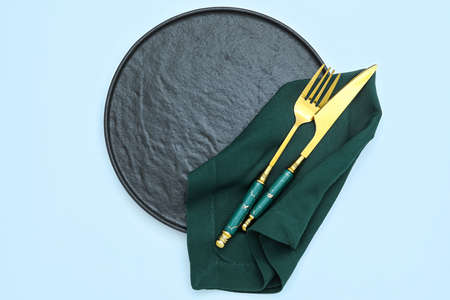 Elegant table setting on blue backgroundの写真素材