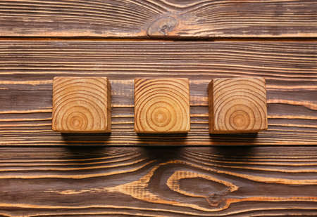 Cubes on dark wooden backgroundの写真素材