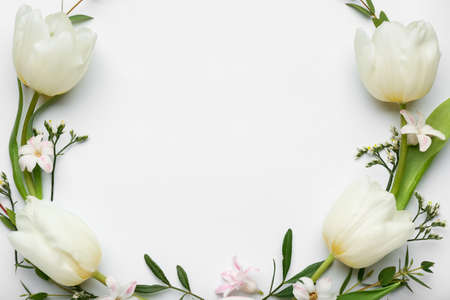 Stylish Easter wreath with tulip flowers on light backgroundの写真素材