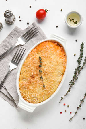 Baking dish with tasty Shepherd's pie on white background