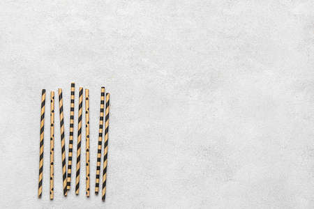 Stylish straws for drinks on grunge backgroundの写真素材