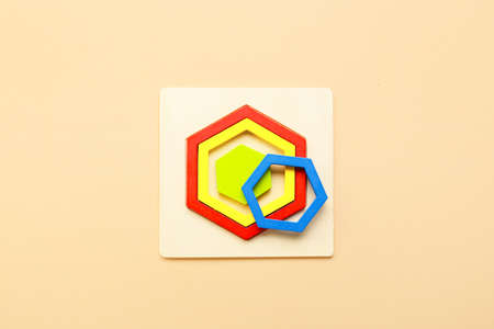 Children's toys on beige background. Concept of autistic disorder